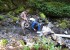 OCAFC facilities director Brian Campbell and facilities assistant Nick David clear debris from the flume intake.